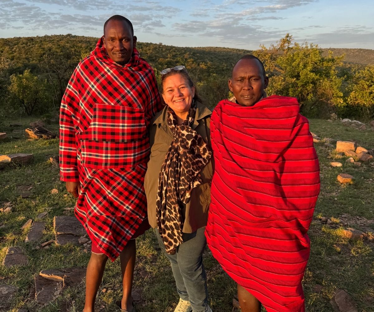 Bushtops Camp guest and two Maasai guides on safari